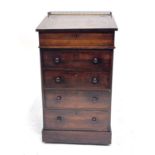 A Regency rosewood Davenport desk, circa 1820, swivel upper section with metal fretwork gallery,