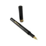 A Brittanic fountain pen, engine turned black barrel and screw posting cap, lever filler warranted
