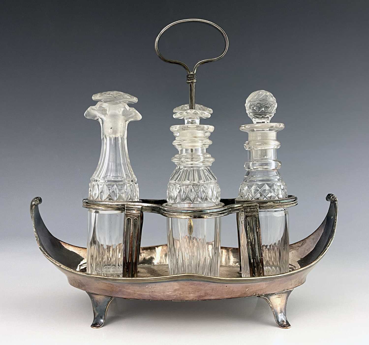 A George III Old Sheffield Plate and cut glass four bottle cruet stand