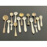 A collection of George III and later silver and mother of pearl salt and condiment spoons, 9.5cm