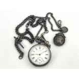 A silver pocket watch and guard chain