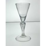 A Dutch hollow baluster wine glass, circa 1740, the concial bowl on a heaxagonal moulded inverse