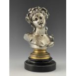 A 19th century silvered bronze bust of Bacchantes, modelled with eyes partially open, on a turned