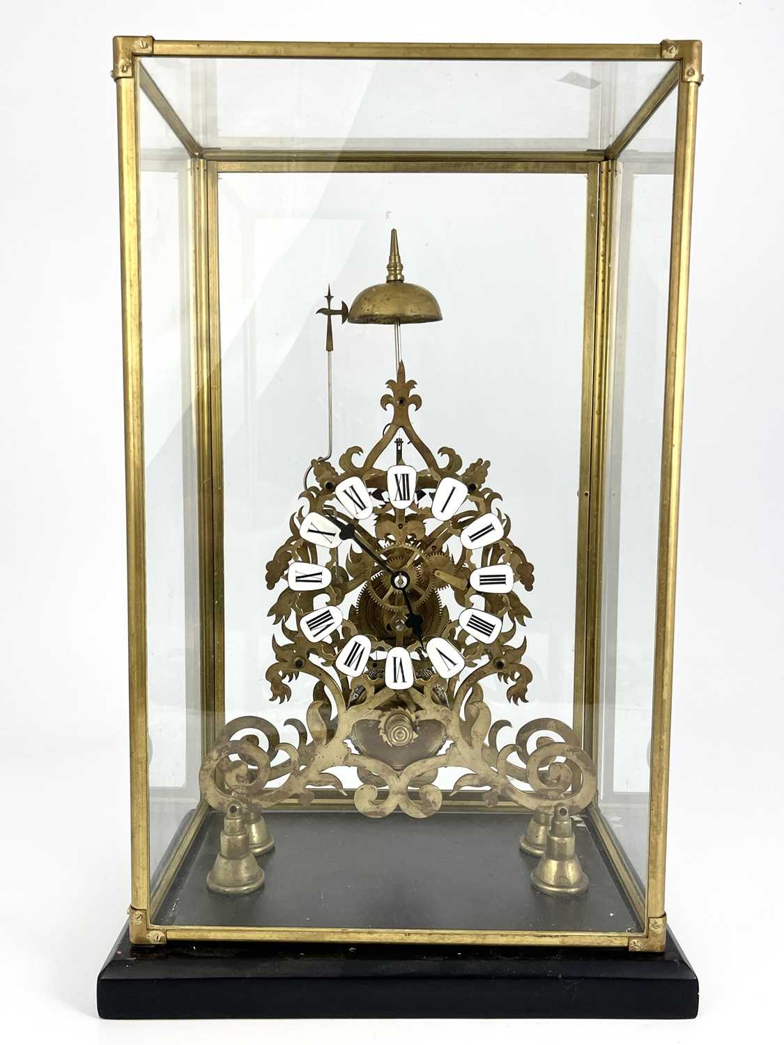 A 19th Century brass skeleton clock, enamel Roman numerals, single fusee movement striking on a