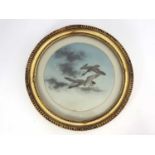 A Japanese circular porcelain plaque, Meiji period, 1868-1912, painted with a pair of birds in