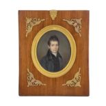 Julia Dagoty, a 19th century portrait miniature, half length oval depicting a gentleman in blue grey