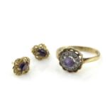 A gold, amethyst and diamond cluster ring and earrings, central stone within a circle of diamonds,
