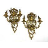 A pair French gilt ormolu double branch wall sconces, 19th Century, of openwork Rococo Revival