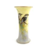 A Royal Worcester painted spill vase, circa 1923, cylindrical flared form, decorated with kookaburra