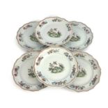 A set of six Chinese famille rose dinner plates, ogee bordered, enamelled with exotic water birds,