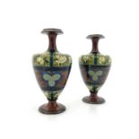 Lizzie Shettleworth for Doulton Lambeth, a pair of faience vases, circa 1885, footed amphora form,