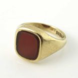 A 9 carat gold and carnelian set signet ring, size R 1/2, 6.6g