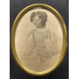 British School, circa 1830, oval portrait miniature of a young lady, half-length seated holding a