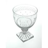 A George III glass rummer, 1805, the ogee bowl engraved with laurel wreath, mongram and date, on a