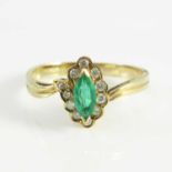 An 18ct emerald and diamond cluster ring, central marquis cut emerald with wrap-a-round band set