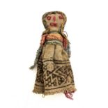 A Peruvian Cahncay textile burial doll, woman with long hair and an expressive face, 18cm high
