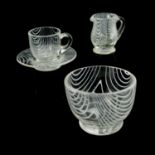 A Victorian Nailsea glass miniature tea set, circa 1870, including bowl, jug, cup and saucer, combed