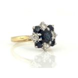 An 18ct gold,Sapphire and diamond set cluster ring, size M