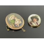 Two gold mounted portrait brooches, oval form, one with a Vienna type roundel, the other glazed with