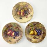 H Price and Albert Shuck for Royal Worcester, a matched set of three fruit painted plates, gilt ogee