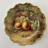 H Price for Royal Worcester, a fruit painted plate, decorated with peaches and grapes, within a gilt
