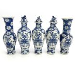 A Chinese blue and white five piece altar garniture, crackled ice and prunus ground, each with