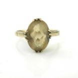 A 9 carat gold and citrine ring, marquise cut stone, size O