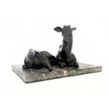 A 19th century bronze figure group, modelled as two resting deer, raised on rectangular marble base,