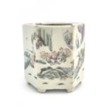 A Chinese famille rose brush pot, octagonal form, painted with a populated garden landscape to one