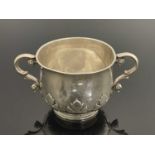 An Edwardian Britannia Standard silver (0.958) two-handled porringer, modelled after the late