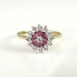 A 9ct gold diamond and ruby cluster ring, ring size M