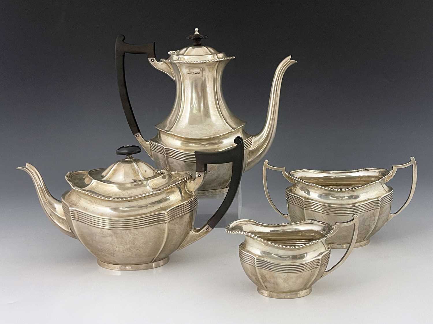 An Edwardian silver four piece tea and coffee set, Barker Brothers, London 1907, ogee section boat