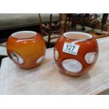 A pair of triple cased studio glass vases, spherical butterscotch over opaque with colourless