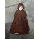 A Schoenau Hoffmeister antique bisque head doll, brown wig, sleeping glass eyes, open mouth, jointed