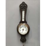 A Victorian carved aneroid barometer and thermometer, 72cm high