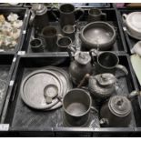 A collection of 19th century and later pewter, including a pair of loving cups with coat of arms