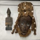 A Tribal carved wood comb and a Dan mask with cowrie shell platted hair (2)