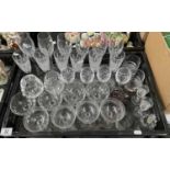 A collection of cut glass drinking glasses, including Stuart Crystal champagne flutes, Victorian