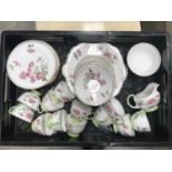 An Ansley twelve piece tea service. 2 serving plates, 12 saucers, 12 cups, 1 milk jug, and 1 sugar