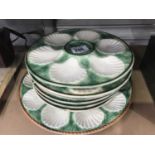 A Chantilly pottery oyster set, comprising six individual plates and a larger serving platter,