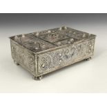 A twentieth-century Persian or Middle Eastern silver-coloured metal filigree box, with hinged cover,