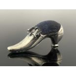 An Edwardian novelty silver pin cushion, modelled in the form of a shoe, with shoe buckle and