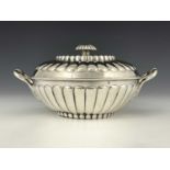 A George III silver bowl and cover, of circular form, the body with bands of fluted decoration,