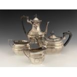 A twentieth century plated four-piece tea and coffee service, comprising coffee pot, teapot, both