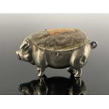 An Edwardian novelty silver pin cushion, modelled in the form of a standing pig or sow, Levi and