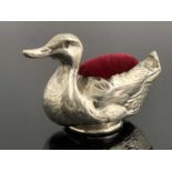 An Edwardian novelty silver pin cushion, larger size, modelled in the form of a duck, the body