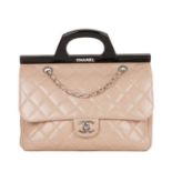 Chanel, a CC Delivery handbag, crafted from pale pink diamond quilted leather, featuring a unique