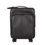 Bottega Veneta, a Nero Intrecciato Trolley suitcase, designed with the maker's black woven leather