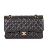 Chanel, a medium Classic Double Flap handbag, designed with a diamond quilted black caviar leather