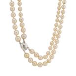 A mid 20th century pearl two-row necklace, with old-cut diamond clasp